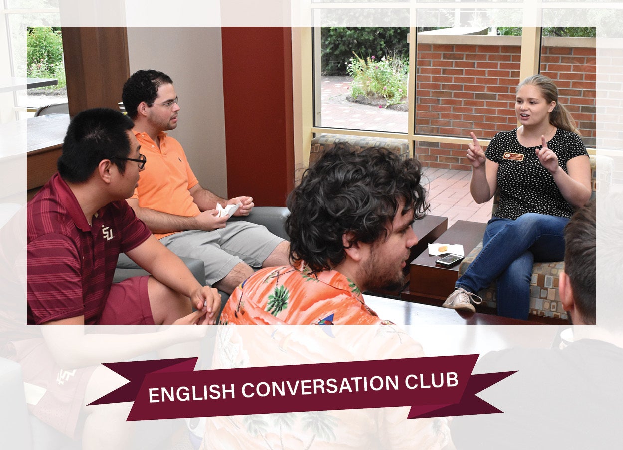 Image of seated students with English Conversation Club banner